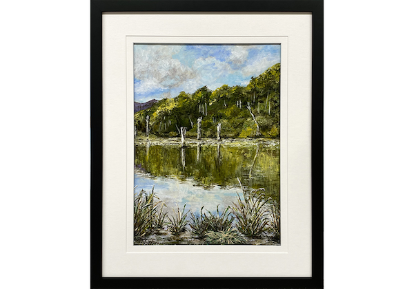 Framed painting of a lake
