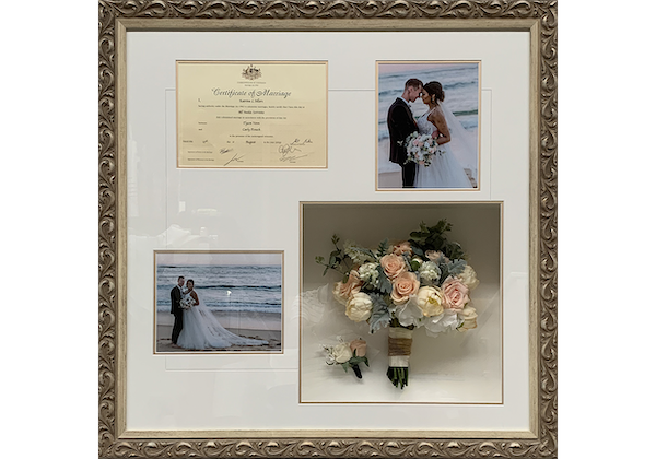 Framed Wedding photos and bouquet